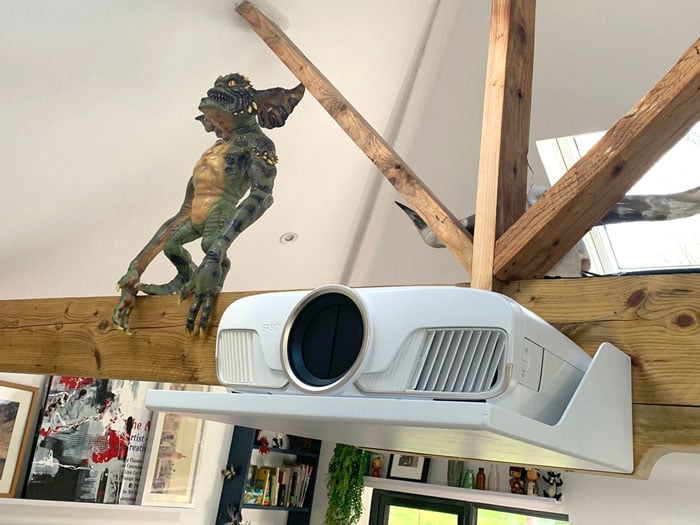 Projector sat on custom shelf attached to beams