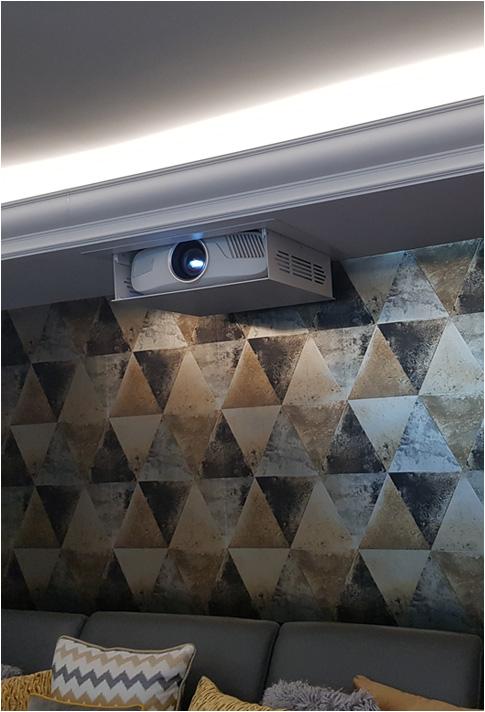 Projector lift in drop ceiling with patterned wallpaper