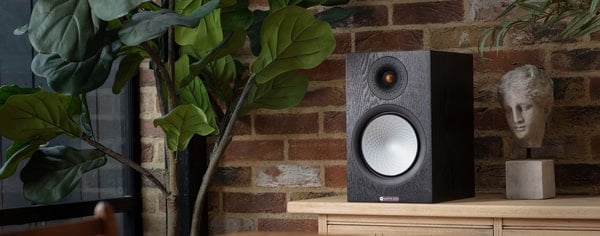 Monitor Audio Bookshelf Speaker Black Oak Silver 100 on cabinet