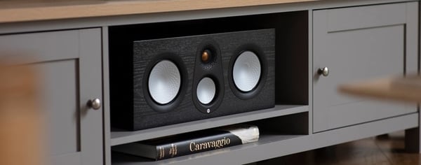 Monitor Audio Silver C250 Black Oak in a cabinet