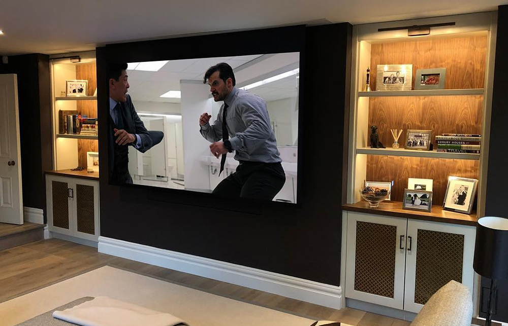 tv and projector in living room home cinema