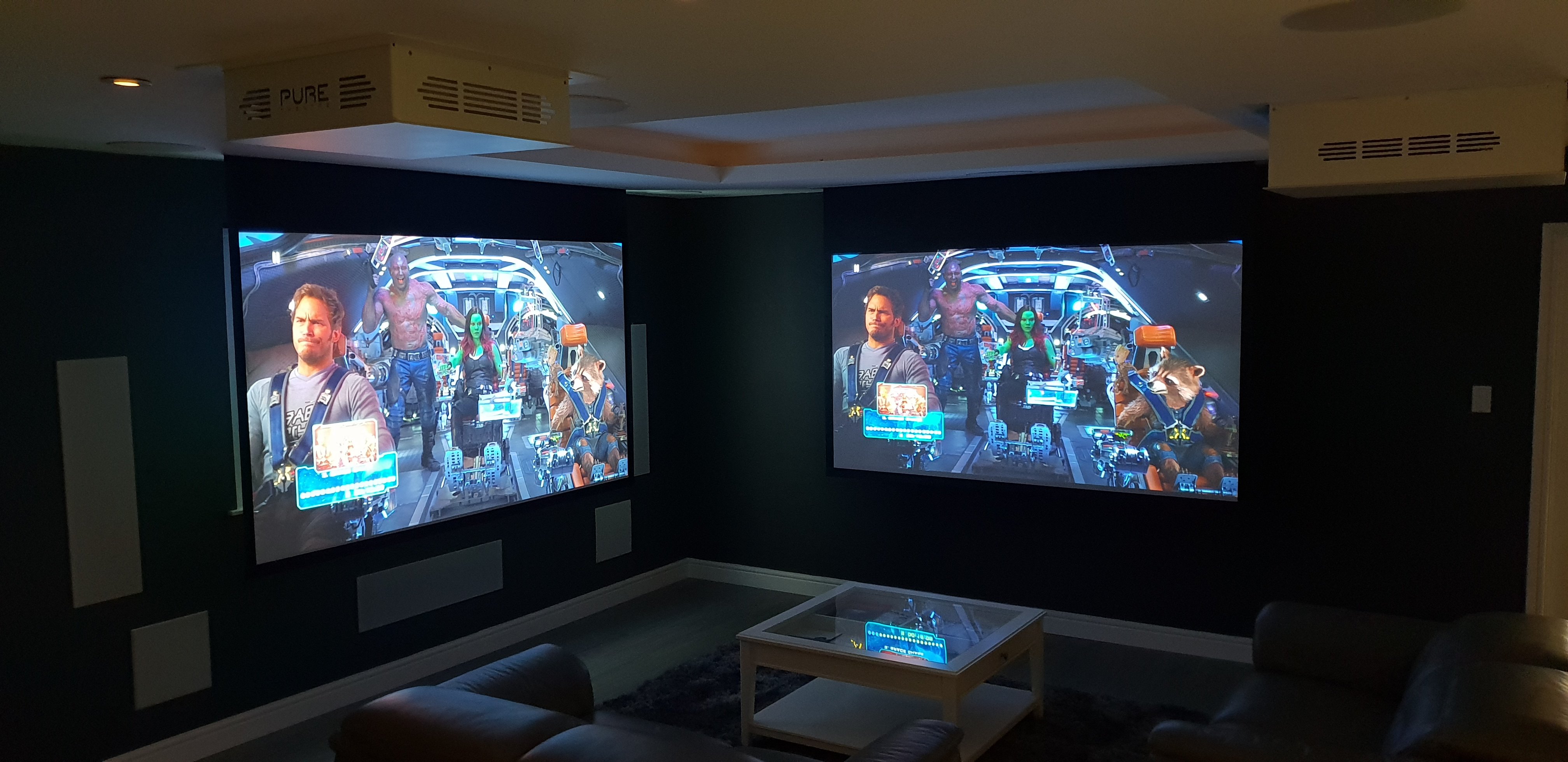Pure Theatre Concealed Projector Screens on Demo Side by Side