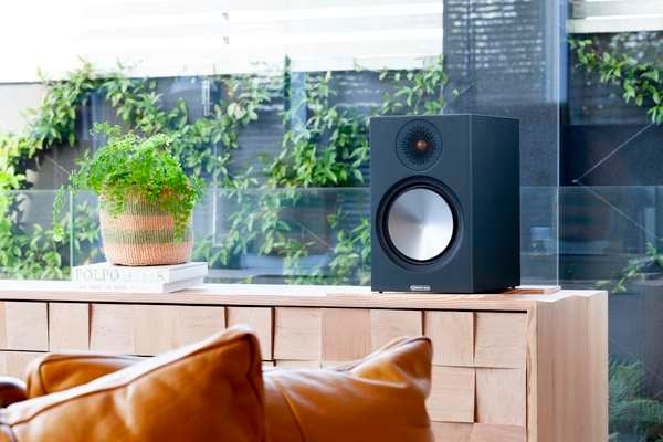 Monitor Audio Bronze 100 Bookshelf Speakers Black in a living space