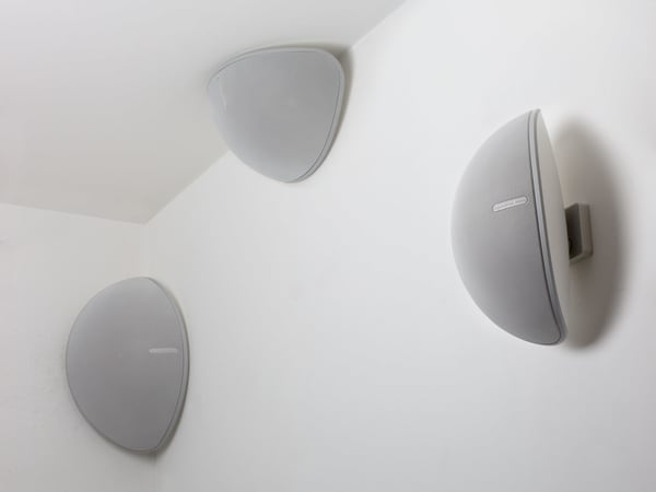 Three Monitor Audio Vecta V240 in white on a wall 