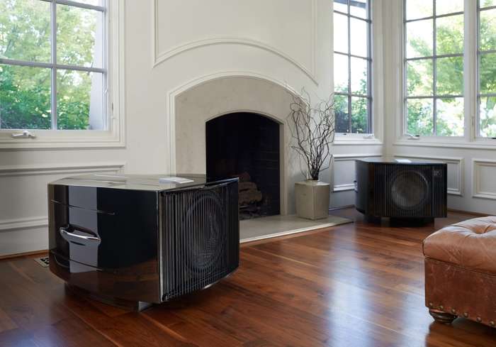 Two REL No. 25 Subwoofers by a fire place