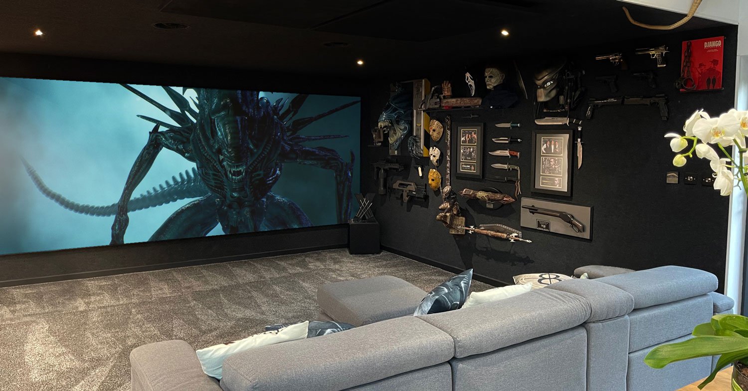 Dedicated home cinema with alien playing on screen