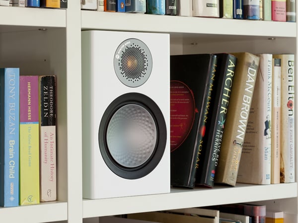 Monitor Audio Silver 50 White Bookshelf Speaker on a Bookshelf