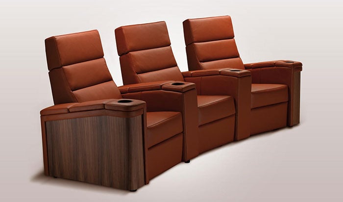 Trio of tan home cinema chairs with cup holders
